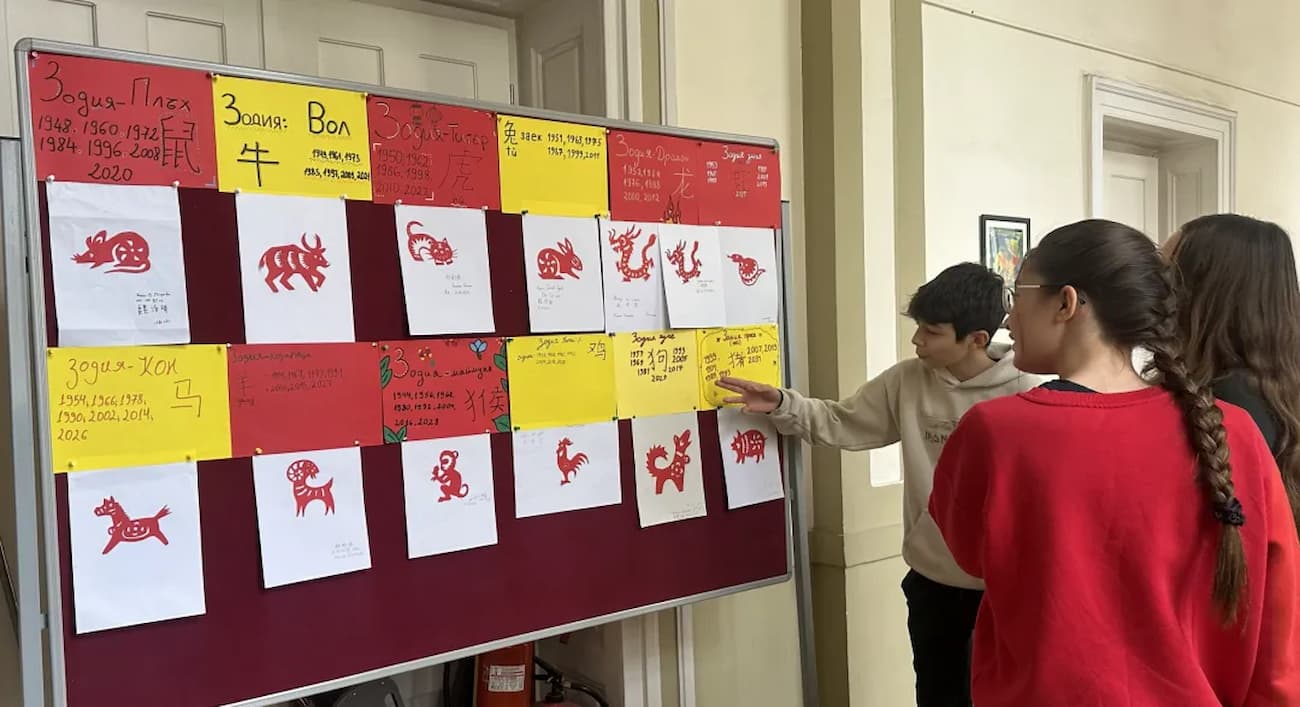 Photo 6: Students viewing the exhibition